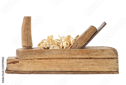 Old wooden jointer and wood shaving on a white background photo