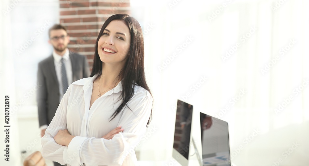 Portrait of confident young business woman in the office.
