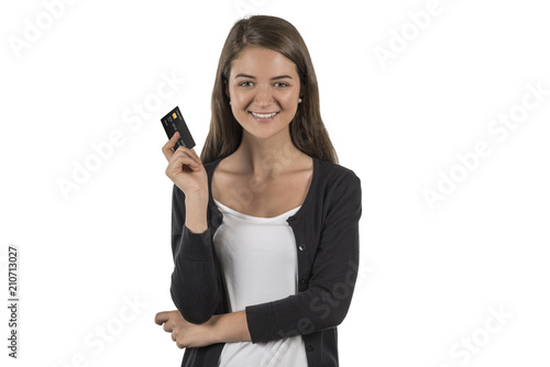 Happy woman holds a credit card in her hand