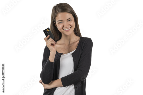 Happy woman holds a credit card in her hand