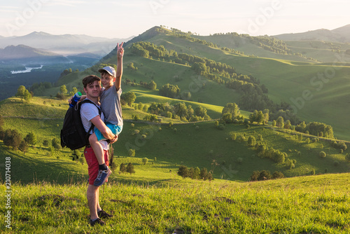 Happy father and son are wa...