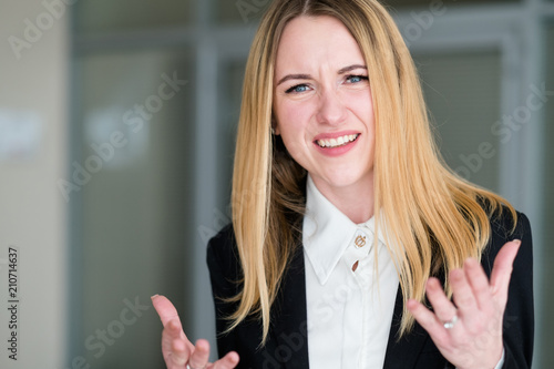 emotion face unbelievable. astonished dumbfounded bewildered astounded shocked perplexed woman. business lady at office workspace. young beautiful blond girl portrait