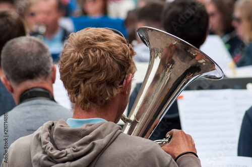 closeup of tuba player in the street photo