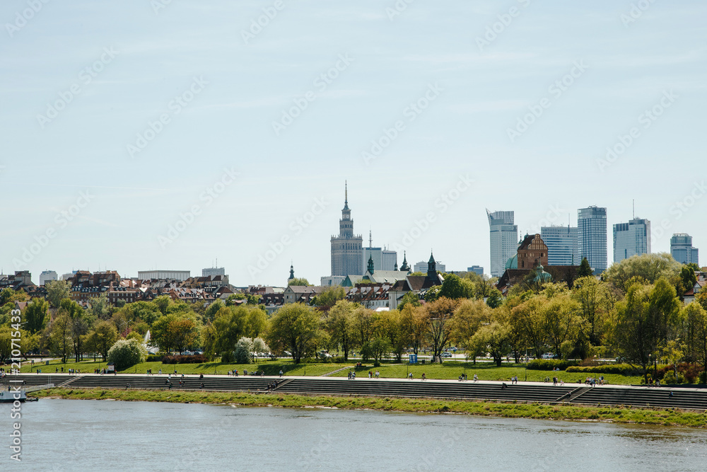 City over the river. Warsaw over the Vistula. The old town is the Polish and Viennese Boulevards. Old and owen parts of the city. Architecture. Temples and churches. High-rise buildings and historic