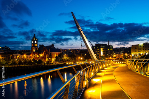 Illuminated Peace bridge in Derry Londonderry in Northern Ireland