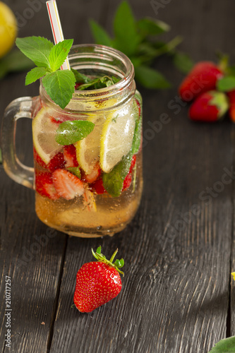 cocktail with fresh fruits, berries and mint