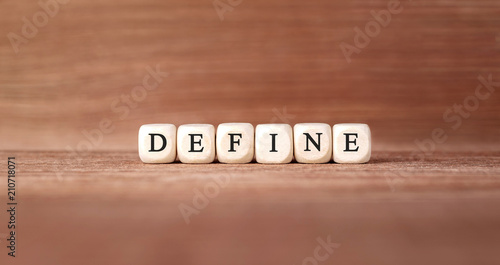 Word DEFINE made with wood building blocks
