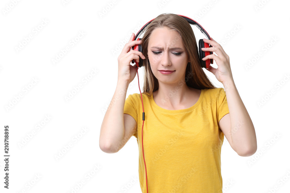 Young woman with headphones on white background Young woman with headphones on white background