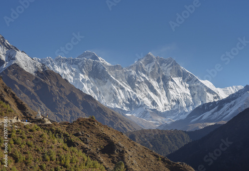 Group of trekkers, stupa, Everest and Lhotse