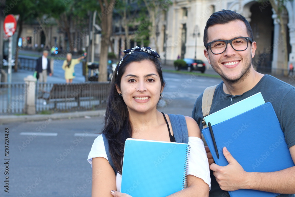 Ecstatic couple of ethnic international students abroad Ecstatic couple of ethnic international students abroad