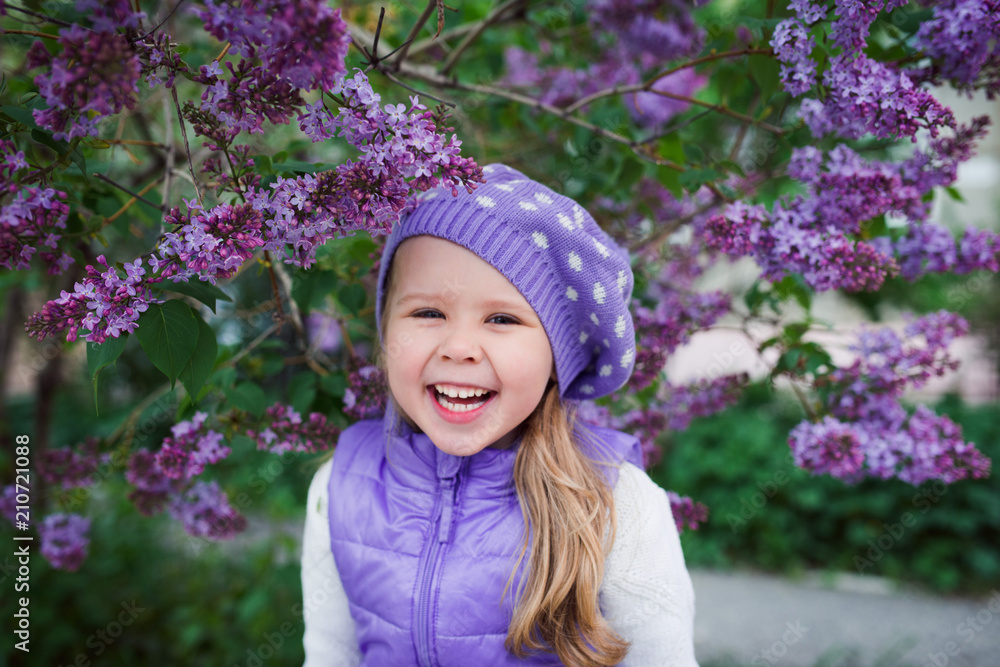 Cute happy girl in lilac hat Cute happy girl in lilac hat