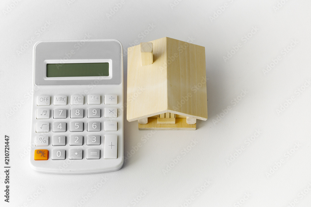 Mortgage Cocept, Scandinavian house and pile of coin money on brown wooden frame, with copy space in midle of the frame. Mortgage Cocept, Scandinavian house and pile of coin money on brown wooden frame, with copy space in midle of the frame.