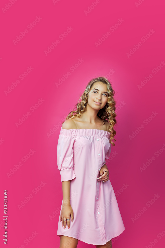 Pretty stylish Beautiful girl wearing pink dress posing