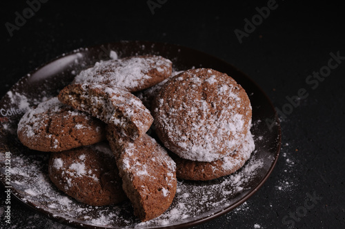 oatmeal cookies on a black table in castor sugar