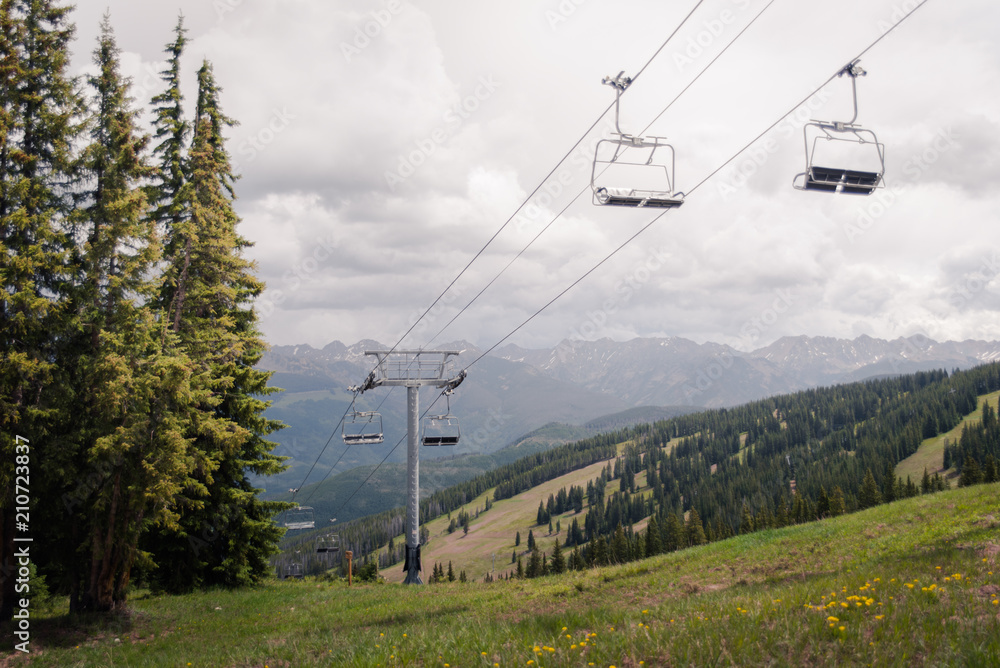 A ski lift with a storm in the back ground in Vail, Colorado. 