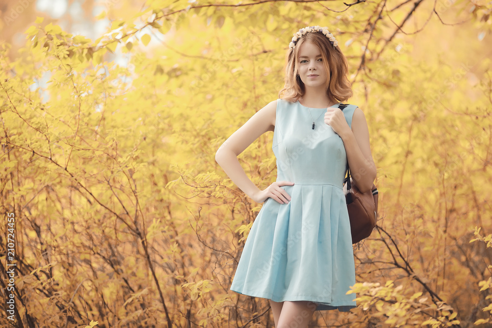 Young girl on a walk in the autumn Young girl on a walk in the autumn