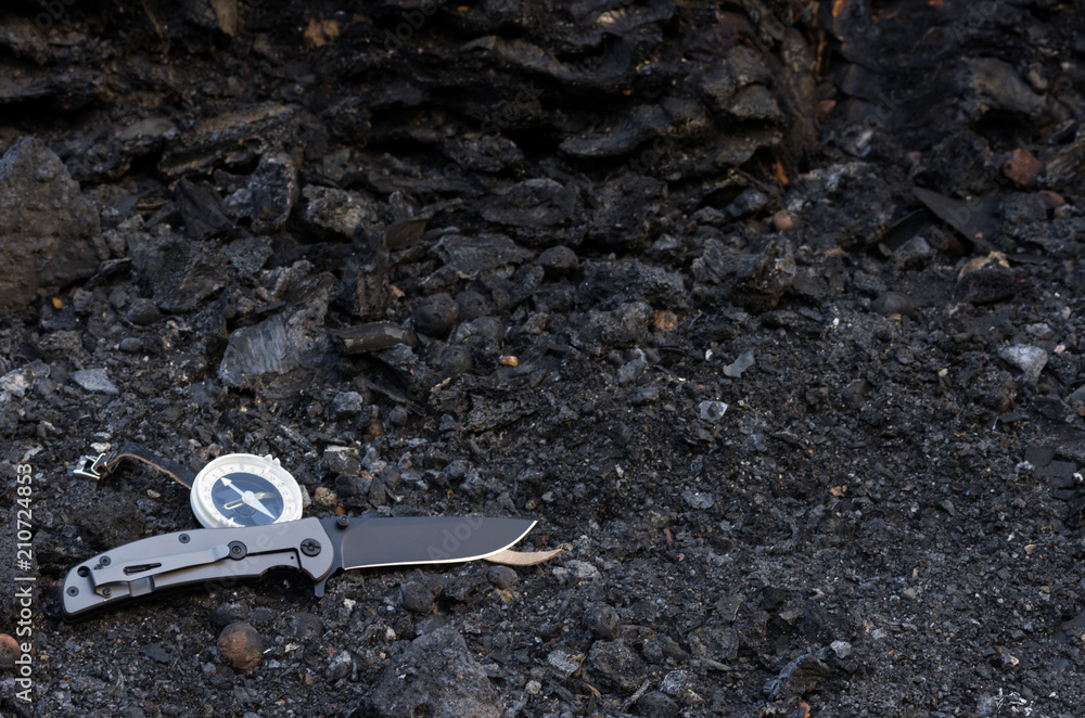 Obraz premium Knife and compass. A lot of space. Items for survival. Front.