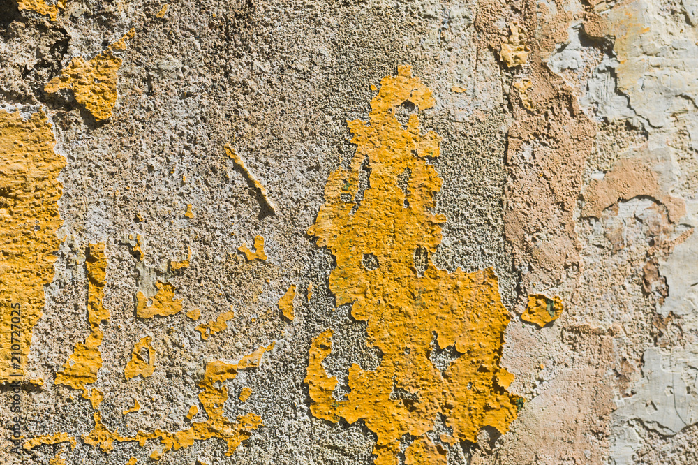 Textured grunge background. Volumetric plastered wall with a multilayer cracked coating. Orange chips on the whitewashed wall. Grunge texture with a deep pattern Textured grunge background. Volumetric plastered wall with a multilayer cracked coating. Orange chips on the whitewashed wall. Grunge texture with a deep pattern