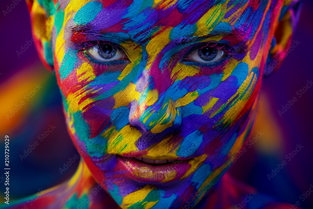 Portrait of the bright beautiful woman with art colorful make-up and bodyart Portrait of the bright beautiful woman with art colorful make-up and bodyart