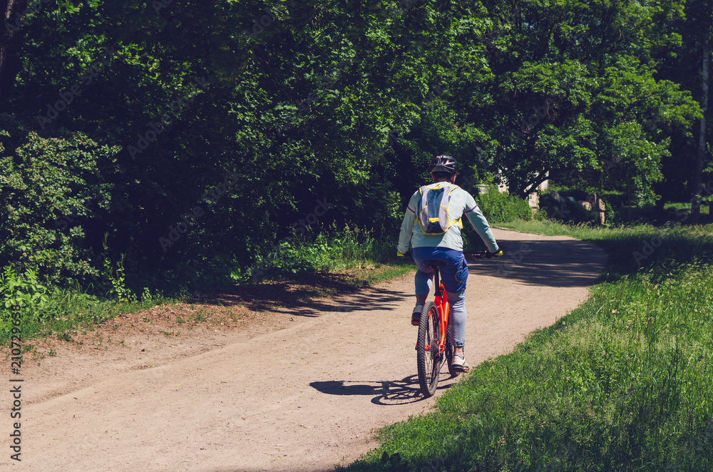 Obraz premium The cyclist in motion riding bicycle road
