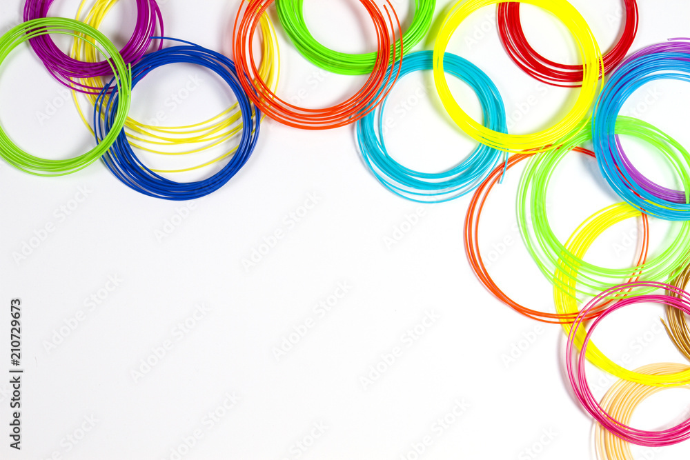 Colorful 3d pen filaments on white background, top view Colorful 3d pen filaments on white background, top view
