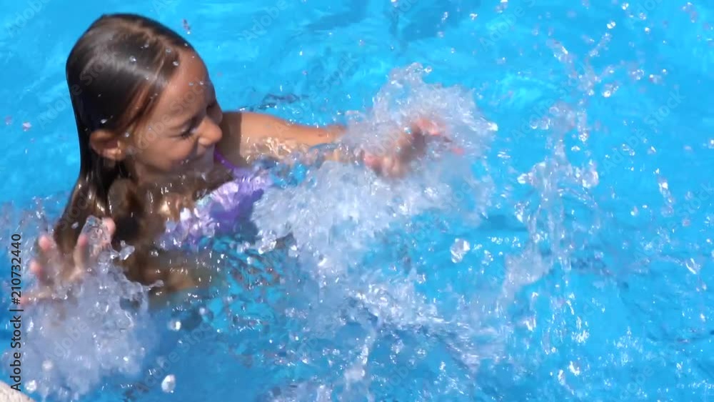 Little girl swimming in the pool Little girl swimming in the pool