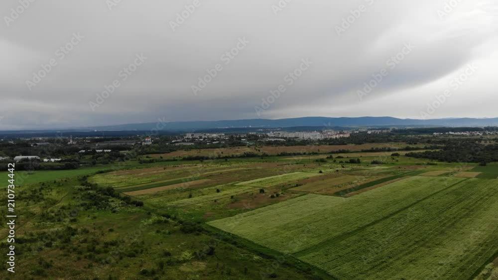 Ukrainian lands, view from the height. The once an industrial city of Drohobych on background, center of saltmaking in Ukraine Ukrainian lands, view from the height. The once an industrial city of Drohobych on background, center of saltmaking in Ukraine