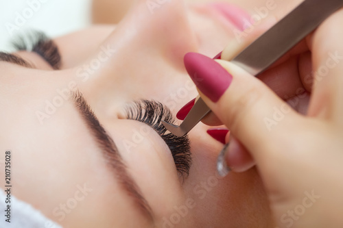 Obraz na plátně Eyelash extension procedure close up