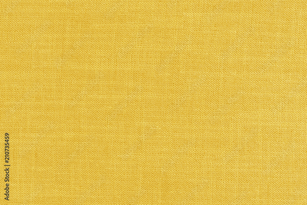 Yellow fabric texture background. Empty abstract cloth backdrop