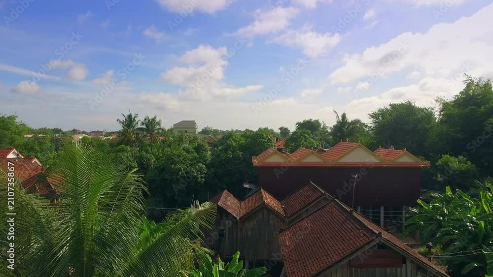 aerial drone shot : fly up revealing an Asia village along riverside aerial drone shot : fly up revealing an Asia village along riverside