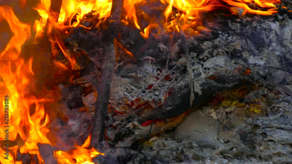On metal burns plastic in the ashes of a fire On metal burns plastic in the ashes of a fire