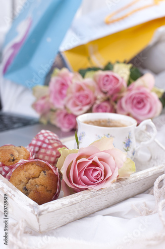 Wallpaper Mural a white bed, packages with gifts, fresh coffee, breakfast cakes and a bouquet of pink roses. Good morning Vintage photo. copy space. Torontodigital.ca