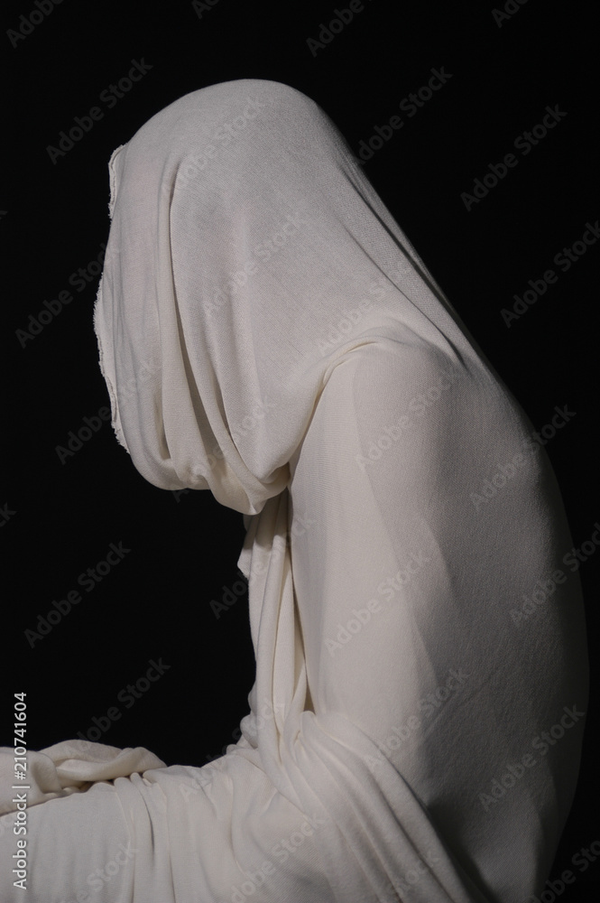 Lazarus, rising from the dead in the tomb. Studio shot of man wrapped ...