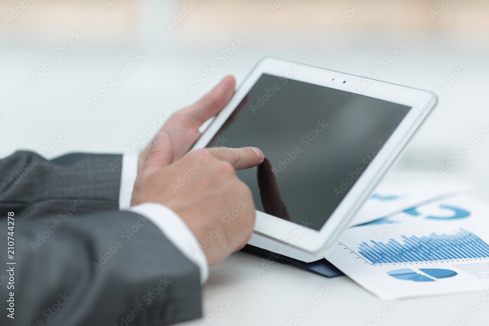 closeup.of businessman hand working with tablet computer closeup.of businessman hand working with tablet computer