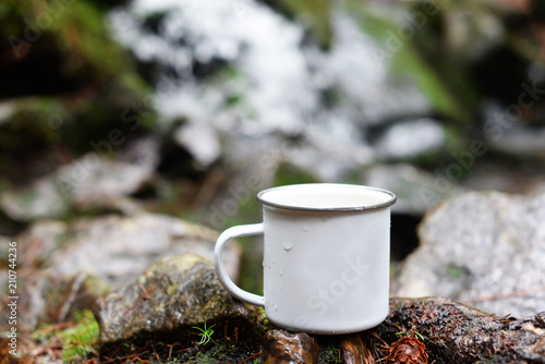 cup tourist aluminum metal white on nature in the forest