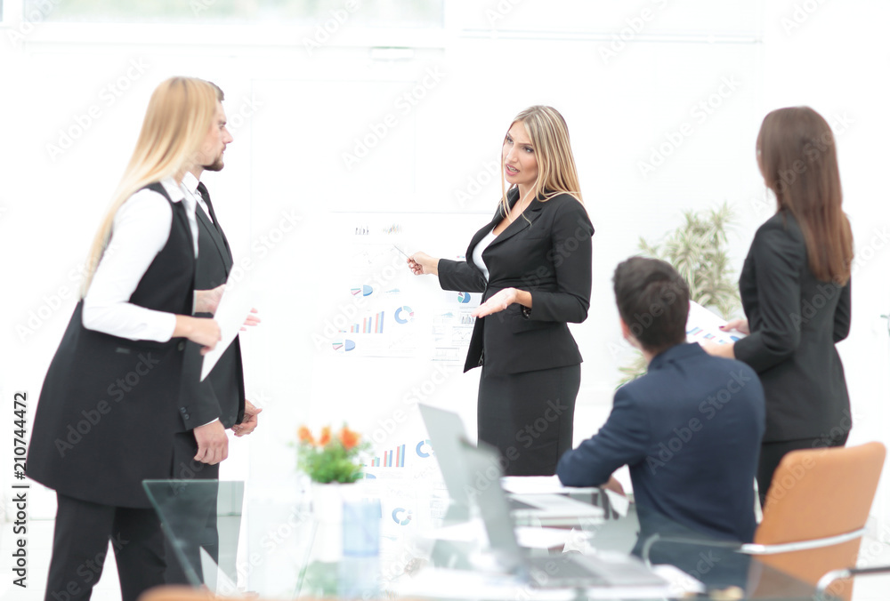 business woman doing a presentation to his business team.