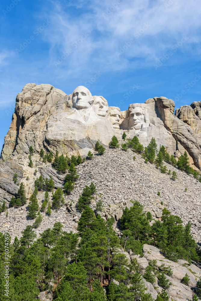 Mount Rushmore national memorial, USA. Sunny day, blue sky. Vertical layout.
