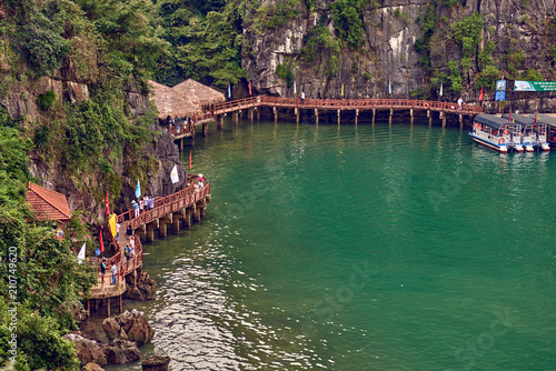 Ha Long Bay , Vietnam-29 November 2014:  Hang Sung Sot cave harbour and tourists who visited the Hang Sung Sot  cave,UNESCO World Heritage Site