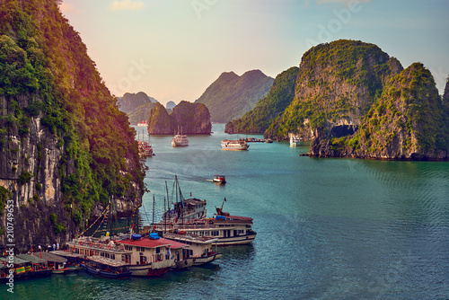 Tourist Junks in Halong Bay,Panoramic view of sunset in Halong Bay, Vietnam, Southeast Asia,UNESCO World Heritage Site