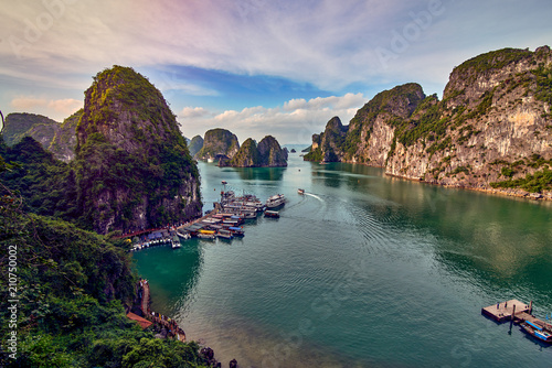 Tourist Junks in Halong Bay,Panoramic view of sunset in Halong Bay, Vietnam, Southeast Asia,UNESCO World Heritage Site photo