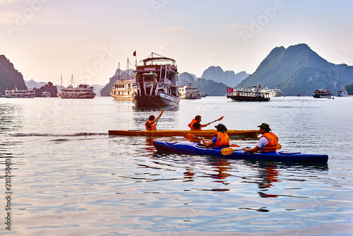 Ha Long Bay , Vietnam-29 November 2014:Couple paddling the kayak in Ha Long Bay, Vietnam, UNESCO World Heritage Site