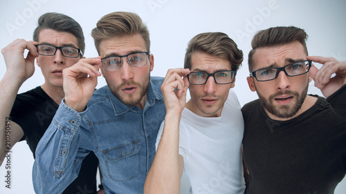 group of creative young men looking at you through glasses