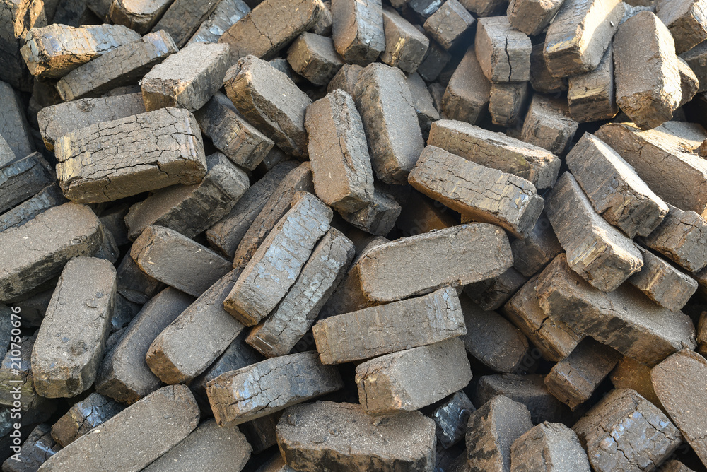 Heap of peat briquettes, alternative fuels, raw material, manufacturing Heap of peat briquettes, alternative fuels, raw material, manufacturing