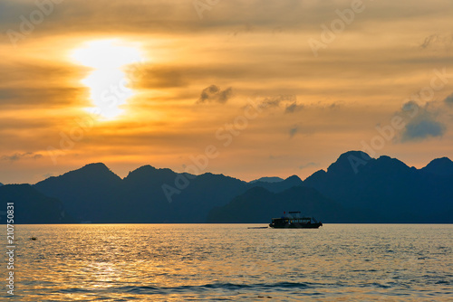 Tourist Junks in Halong Bay Panoramic view of sunset in Halong Bay  Vietnam  Southeast Asia UNESCO World Heritage Site