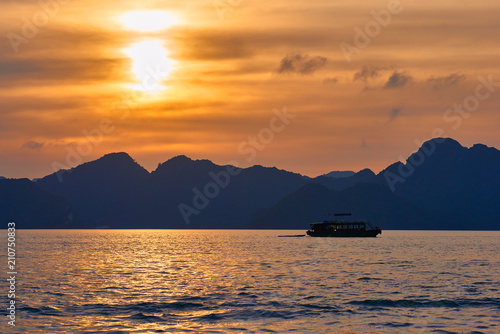 Tourist Junks in Halong Bay Panoramic view of sunset in Halong Bay  Vietnam  Southeast Asia UNESCO World Heritage Site