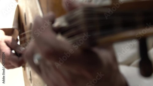 Person playing guitar, close up