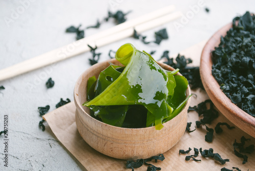 asian seaweed in wooden bowl. dried and wet variation
