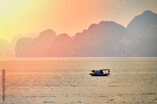 Halong bay boats,Sunset at Ha Long Bay scenic view , Hanoi, Vietnam