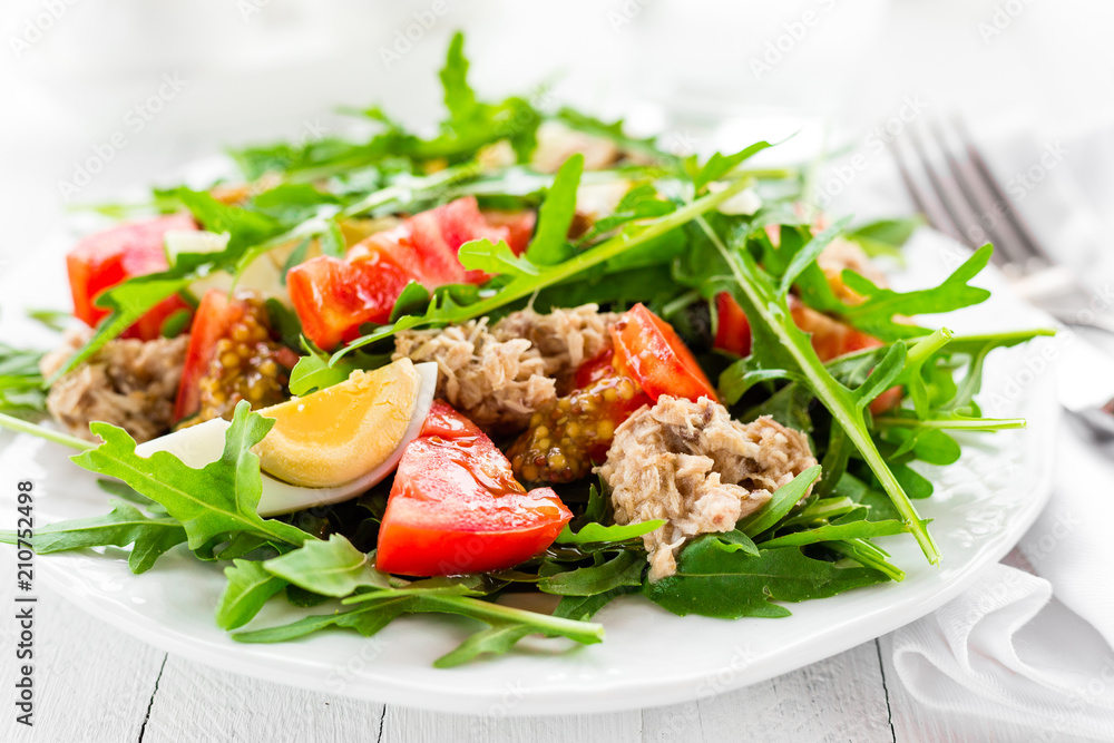 Salad with tuna. Vegetable salad with boiled egg, tuna and arugula. Fish salad Salad with tuna. Vegetable salad with boiled egg, tuna and arugula. Fish salad