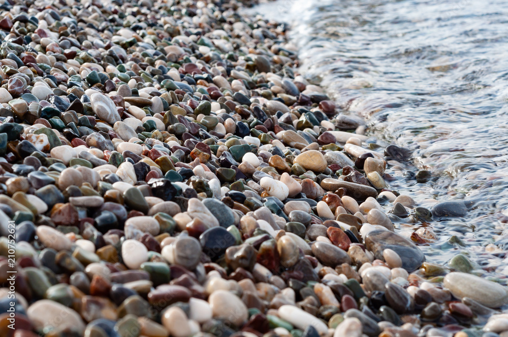 Sea pebbles on the shoreline, close-up Sea pebbles on the shoreline, close-up